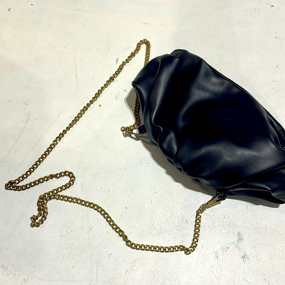 Black evening back with gold chain